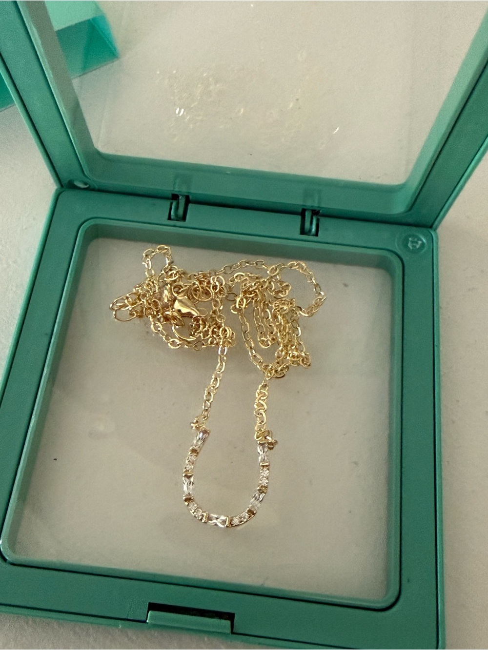 New in box Chesky gold tone rhinestone horseshoe necklace